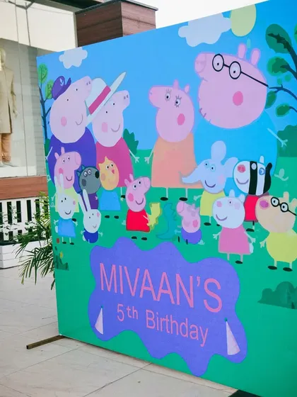 A large, vibrant photo backdrop for the Peppa Pig party, perfect for capturing memories with all the favorite characters.