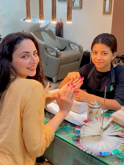 Actress Zoya Afroz looking radiant while getting a manicure at our salon. She chose a beautiful bright pink shade for her nails.