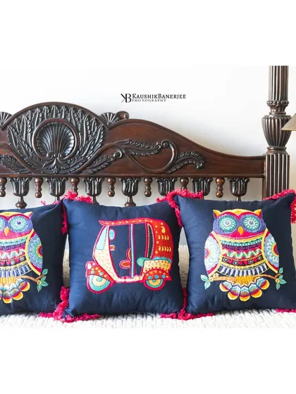 A styled shot for the home decor brand Ekasmaye. I arranged these quirky, bohemian cushions to highlight their vibrant embroidery and unique designs against a classic wooden headboard, showing how they can liven up a space.