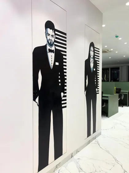 Art belongs everywhere, even in the washroom. I created these full-height, black and white painted murals to add a touch of unexpected style and personality to a corporate space.