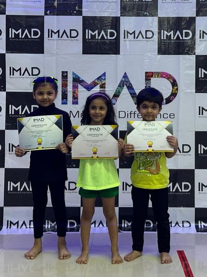Our little ones proudly holding their first-ever performance certificates.
