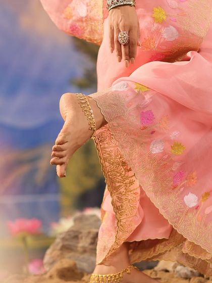 A detail shot of the Gulnaar collection, highlighting the intricate embroidery on the hem of the pants.