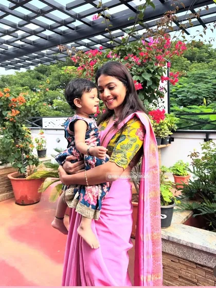A perfect example of a 'Mommy and Me' concept. I used the vibrant floral fabric from the mother's blouse to create a matching dress for her daughter. It's these little details that create a special connection and make for beautiful photos.