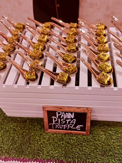 I love creating unique fusion sweets like these Paan Pista Truffles. Each bite-sized truffle combines the refreshing flavor of paan with the richness of pistachio, served on individual spoons for easy enjoyment.