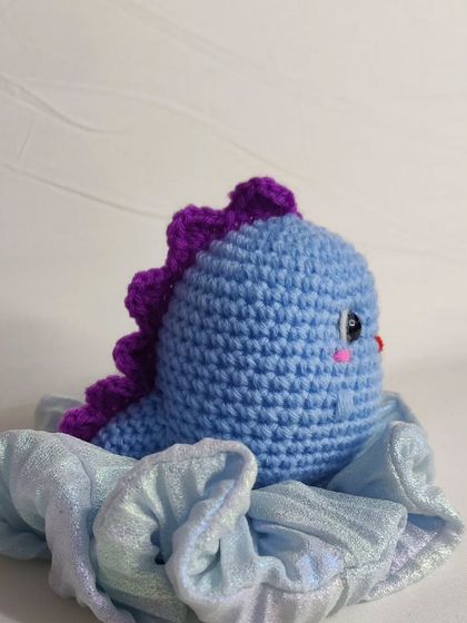 My tiny dino keychains are a handful of cuteness. They come in four different colors: blue, yellow, green, and grey.