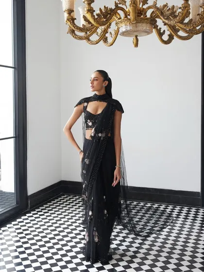 A black patchworked saree with a veil from Istya’s Elan’24 collection. This is a poetic blend of power, texture, and fluidity for the woman who wears heritage like armour.