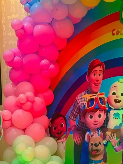 A detailed shot of the Cocomelon backdrop, showing the high-quality character prints.