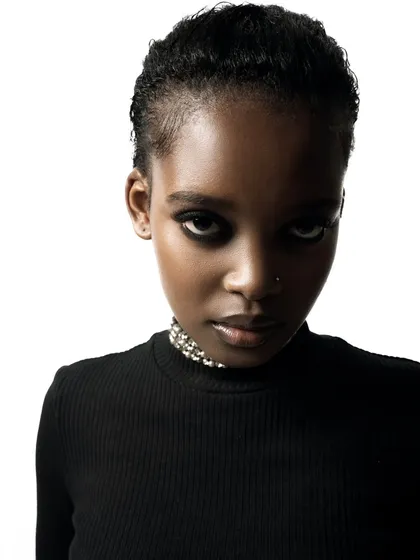 The power of a direct and simple headshot. My focus here is on capturing the model's essential features and intense gaze with clean, high-contrast lighting, perfect for an agency-standard portfolio.
