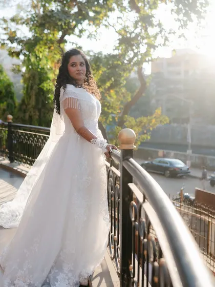 A beautiful portrait of the bride on her wedding day. The sunlight catches her glow, a result of careful skin prep and light-handed makeup.