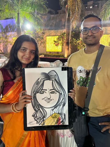 A guest from the Ambegaon wedding with her finished portrait. I aim to make each drawing a unique reflection of the person.
