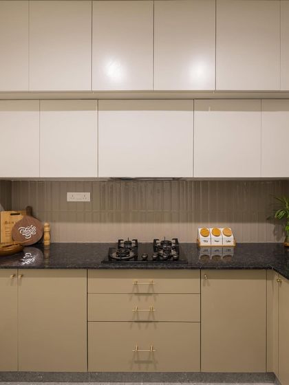 A straight-on view of the kitchen, showing the clean lines of the cabinetry and the well-organized cooking space.