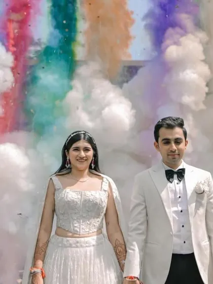 A colorful smoke bomb entry that adds a huge wow factor to the couple's celebration.