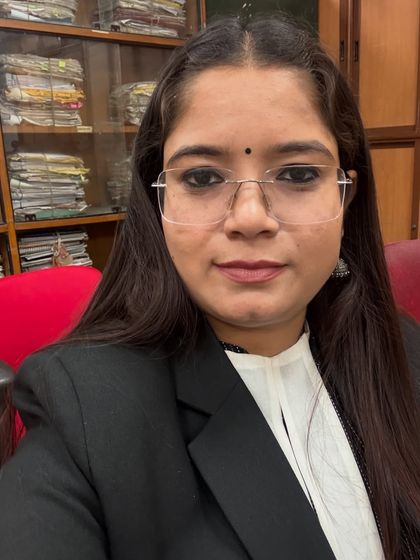 A selfie from my office. The background filled with case files is a testament to the hard work that goes into every single matter.