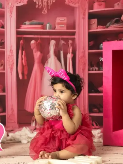 A little girl celebrating her first birthday, Barbie style. I provide the costume and props to make her milestone shoot extra special and vibrant.