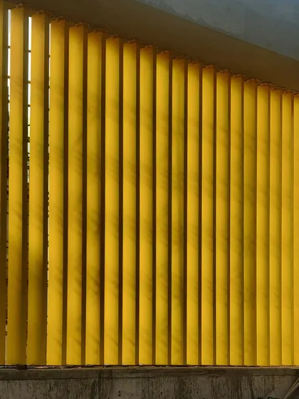 A close-up of the colourful louvres being installed on the facade of an upcoming school in Gurugram. These elements will provide solar shading while adding a vibrant and playful character to the building.