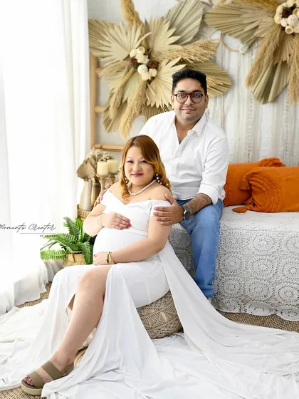A relaxed family portrait in my cozy boho corner. The natural textures of pampas grass and the peacock chair create a warm and inviting atmosphere for couple and family shots.