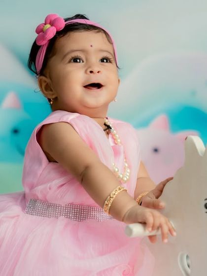 A close-up of the pure joy on her face as she enjoys her magical rocking horse ride.