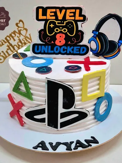 Level 8 unlocked! A PlayStation theme cake for a gamer's birthday. This 1 kg chocolate truffle cake is decorated with the iconic controller symbols and a custom topper.