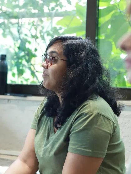 A natural, unposed shot of a guest listening to the conversation.