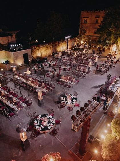 An aerial view of the stunning reception setup in the courtyard of Khimsar Fort, designed for a magical dinner under the stars.