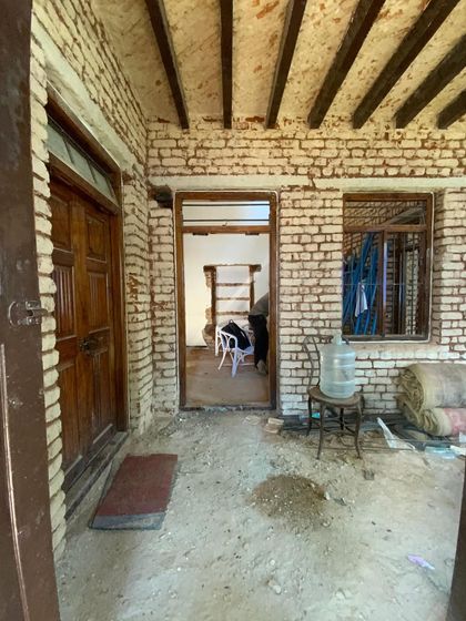A glimpse into the past. The original entrance and brickwork of the 100-year-old villa, showing the bones of the structure we are working to restore and enhance.