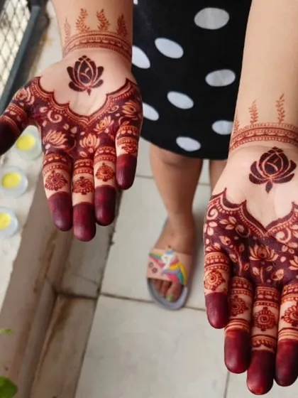 A lovely mother-daughter duo with matching lotus henna for Diwali. The designs are simple yet elegant, with a dark, beautiful stain.