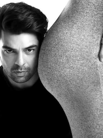 A striking pose from a dad-to-be. This image showcases a different, more intense emotion of protectiveness and anticipation during the pregnancy journey.