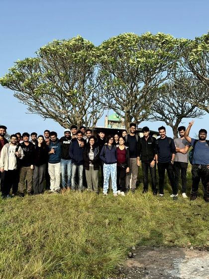 A group photo from our Narayanagiri trek, with the unique trees at the summit.