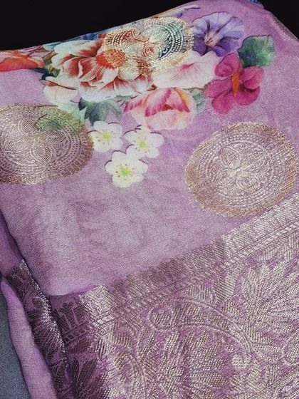A close-up of our lavender viscose saree, showing the beautiful digital print and the shimmering zari butti. It’s a perfect blend of modern printing techniques and traditional weaving.