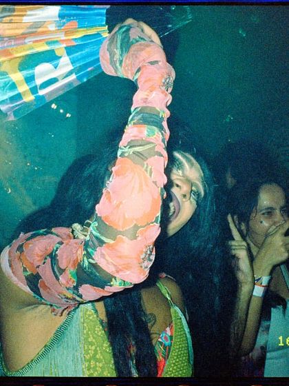 Another candid film photo of me enjoying the party with friends, fan in hand. It’s all about creating a space where I can have as much fun as the guests.