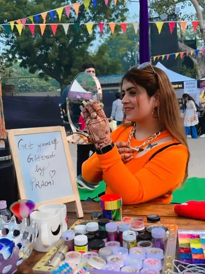 At my glitter makeup station during the Boho Bazaar. It was so much fun helping people get "glittered up" for the event. I love being part of these vibrant, high-energy festivals.