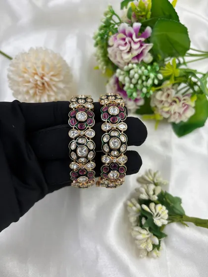 A close-up look at our Gulzar openable bangles. Notice the detailed Mina Kari work and Moissanite Kundan setting. The openable clasp is a key feature, making it a versatile and easy-to-sell item for all your customers.