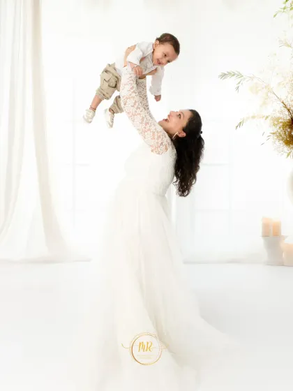 The pure joy between a mother and her baby. I guide my clients into poses that feel natural, allowing for spontaneous, candid moments like this to happen.