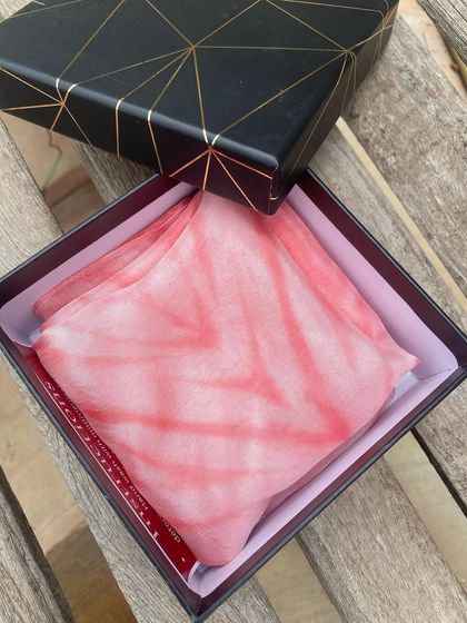 A beautiful Habotai silk stole, tie-dyed with Sappanwood, elegantly packed in a gift box. It's a perfect, thoughtful gift for anyone who appreciates handmade, sustainable luxury.
