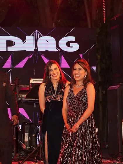 Sharing a laugh with guests on stage. My style is conversational and witty, which helps put everyone at ease and encourages participation.