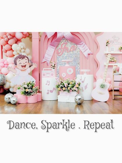 'Dance. Sparkle. Repeat.' This image captures the essence of our dance-themed party, with a full view of the pink, music-inspired setup.