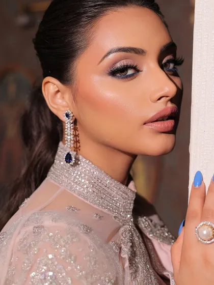A duplicate of 90, this image shows a vision of elegance in a modern saree. This look features bold, smokey eyes and mesmerizing lips, a perfect combination for a cocktail party.