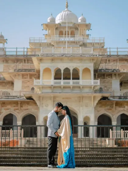A wide-angle shot that captures the full splendor of the Albert Hall Museum. Posing the couple in the center creates a sense of scale and grandeur.
