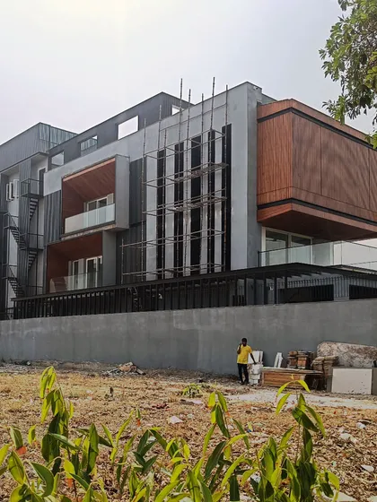 The Lakewood Residence under construction in Faridabad. This image shows the building's form taking shape, highlighting the interplay of different volumes and claddings.