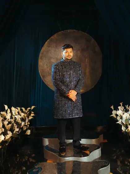 Groom styling is just as important to tell a complete story. For Abhishek's sangeet, we chose this impeccably embroidered navy blue Manish Malhotra ensemble that was refined, stylish, and perfectly complemented the bride's look.