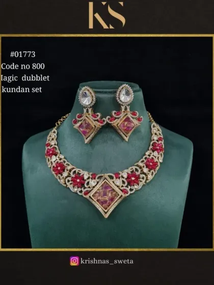 An exclusive magic dubblet Kundan set in a vibrant red. The unique stones and intricate design make this a standout piece for any festive occasion.
