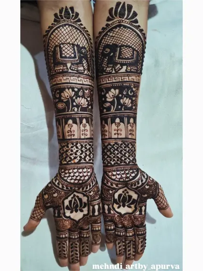 This is a classic bridal mehendi design featuring majestic elephants, a symbol of good luck and prosperity. I balanced the bold animal figures with delicate lotus bands and geometric patterns for a rich, detailed look.
