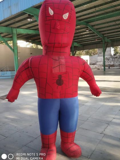 An inflatable Spiderman character, standing tall and ready for action. This is a great addition to any superhero-themed party.