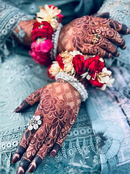 A close-up of the intricate stain details, paired with floral jewelry. The deep color makes every element of the design pop.