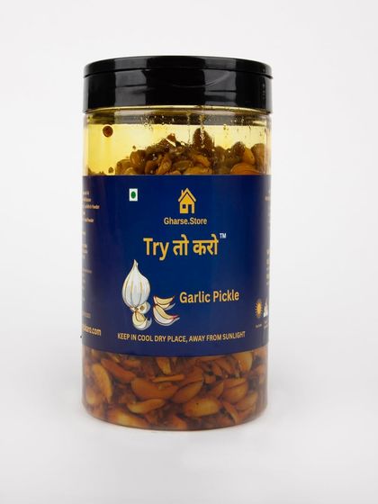 A large jar of Garlic Pickle on a white background.