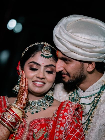 A sweet, intimate moment between a North Indian bride and groom during their wedding ceremony. These are the candid shots that make your wedding album special.