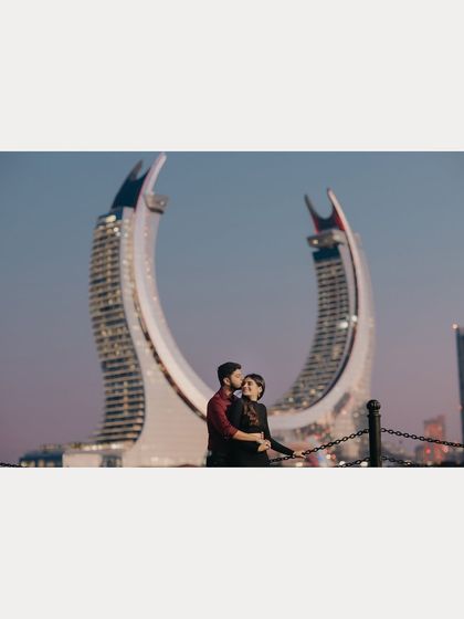 Harshit and Vasudha pose against the futuristic skyline of Lusail, Qatar. This shot demonstrates our ability to capture modern love stories in contemporary international destinations.