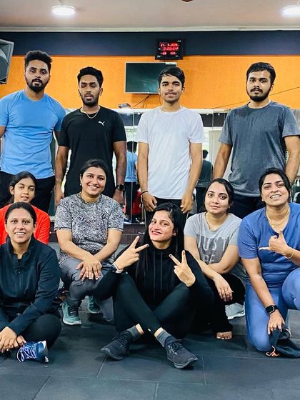 Peace signs and smiles after a tough but rewarding aerobics session.