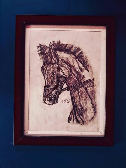 A charcoal sketch of a horse's head, focusing on its powerful form and features.