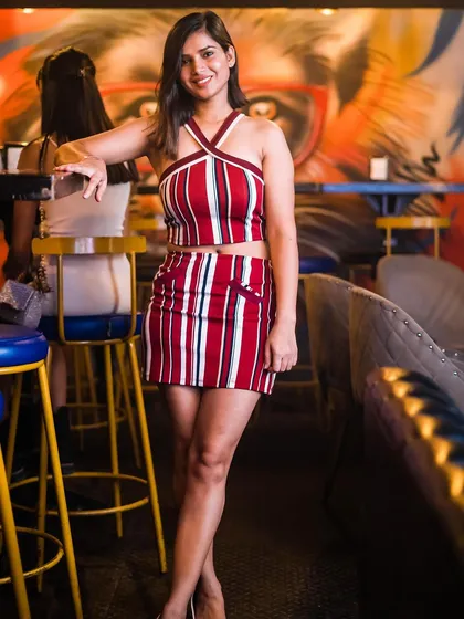 A stylish guest posing at the bar.